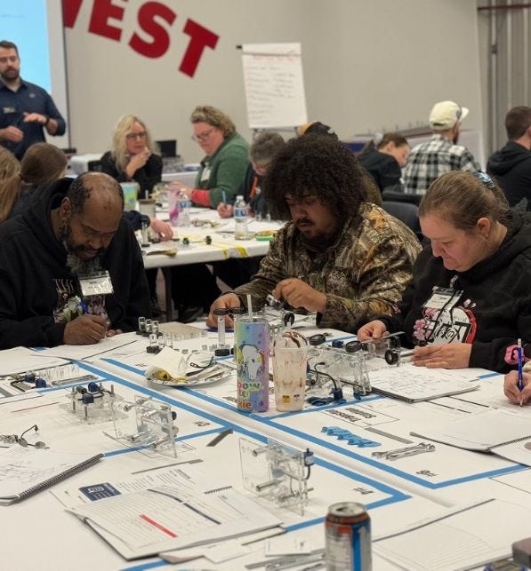 FloraCraft employees work together to complete Lean Training