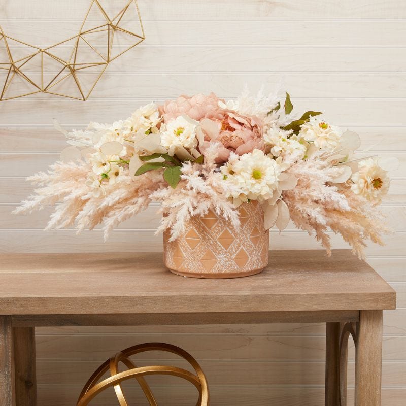 Colorful floral bouquets arranged in the center of a tablescape 