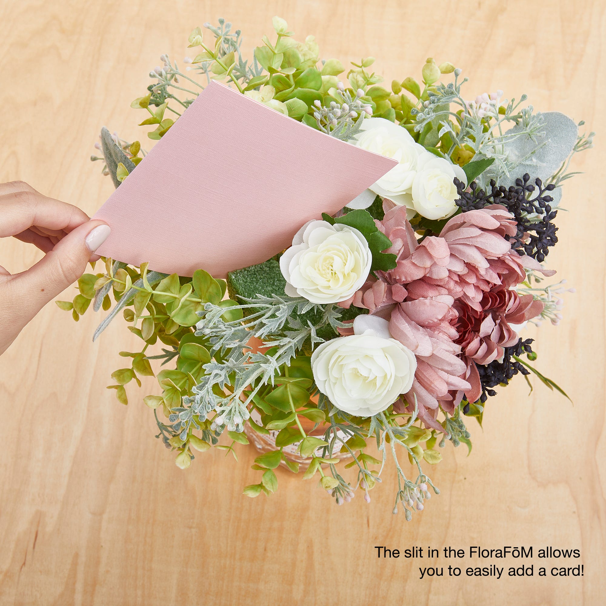 A beautiful FloraCheers! bottle bouquet with a greeting card to celebrate Mother's Day