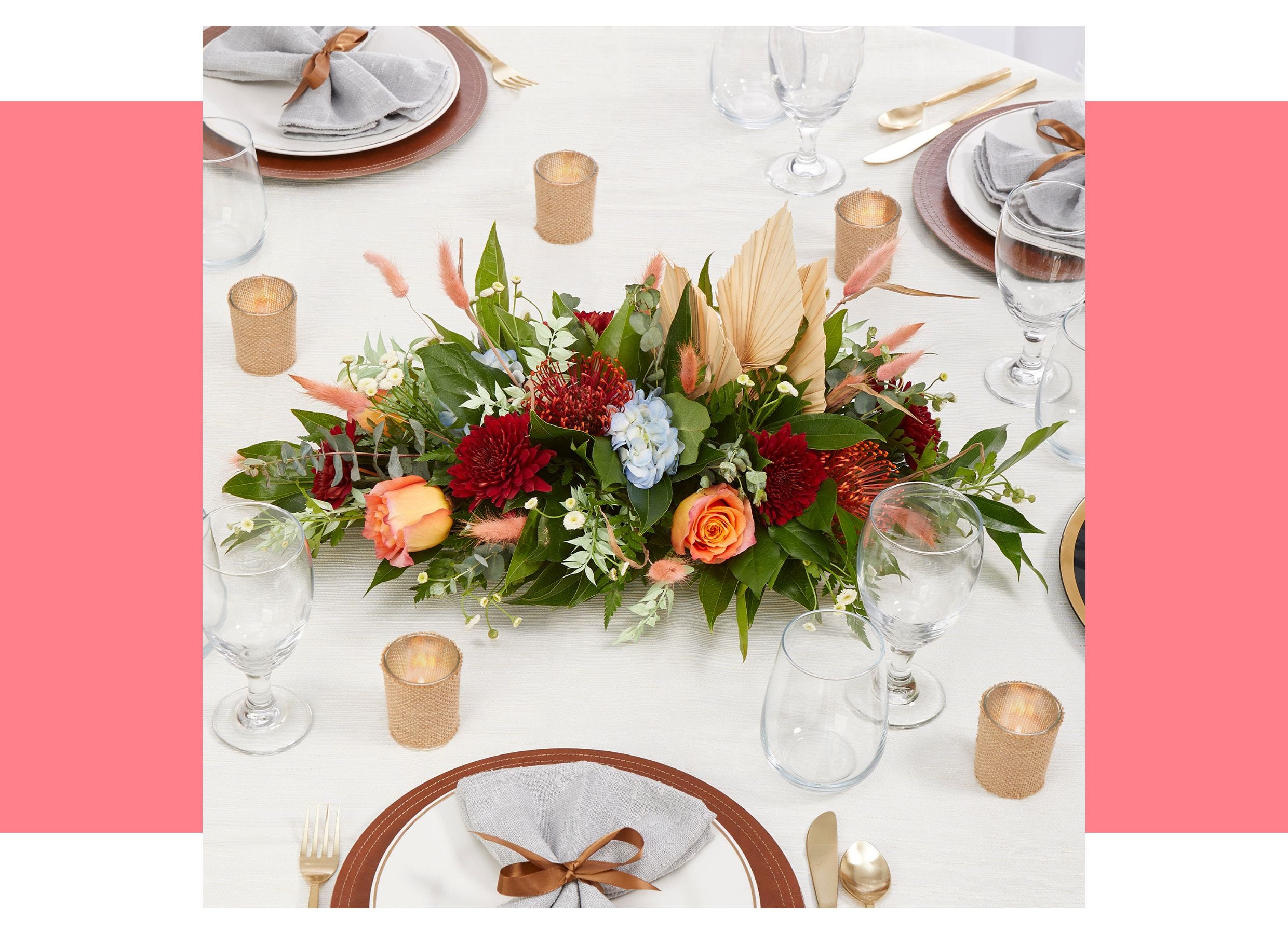 Floral centerpiece in the middle of an Mother's Day event table